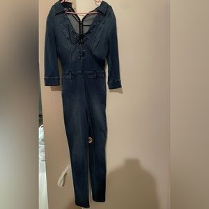 Bebe denim jumpsuit. Lace up front